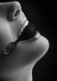 Black and white silicone ball gag with adjustable bonded leather straps